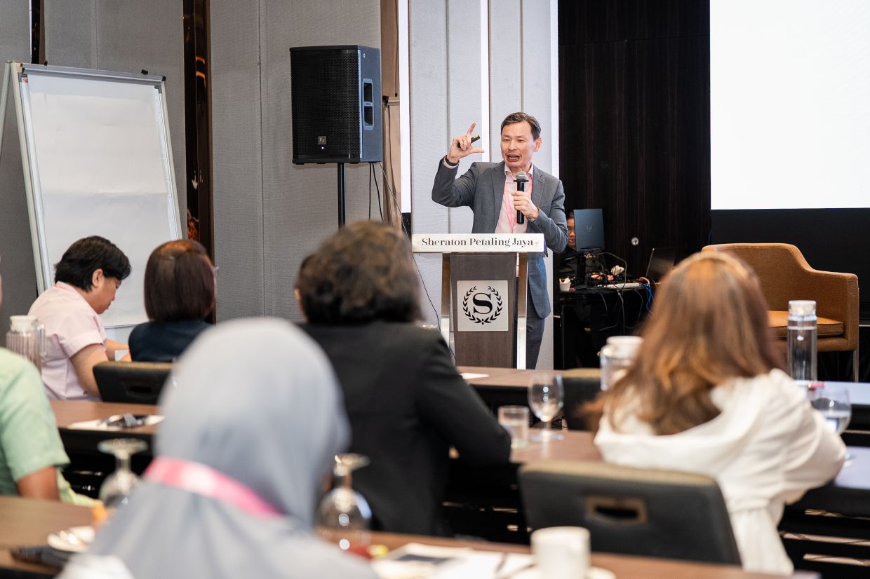 Dr Ng Char Hong gives a lecture during the MDT Series Masterclass in Early Breast Cancer